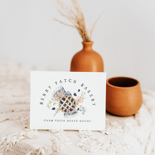Berry Patch Bakery berry pie logo design shown in a boho-style mockup.